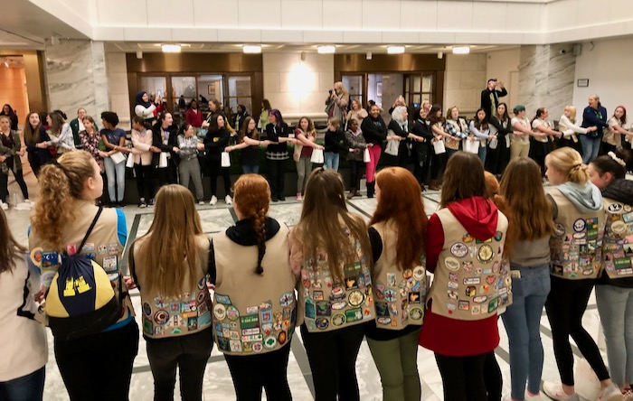 Girl Scouts in a circle at the DIA